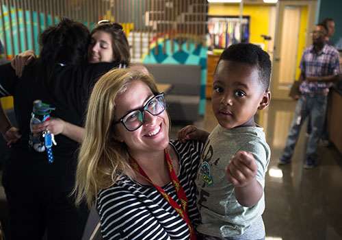 Outreach case worker with a young boy